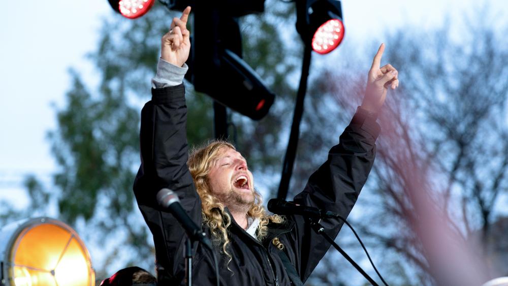 Christian musician Sean Feucht, of California, sings to the crowd during a rally at the National Mall in Washington, Sunday, Oct. 25, 2020. (AP Photo/Jose Luis Magana)