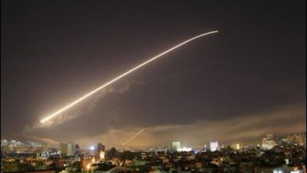 Syria’s capital has been rocked by loud explosions that lit up the sky with heavy smoke as U.S. President Donald Trump announced airstrikes in retaliation for the country’s alleged use of chemical weapons. (AP Photo/Hassan Ammar)