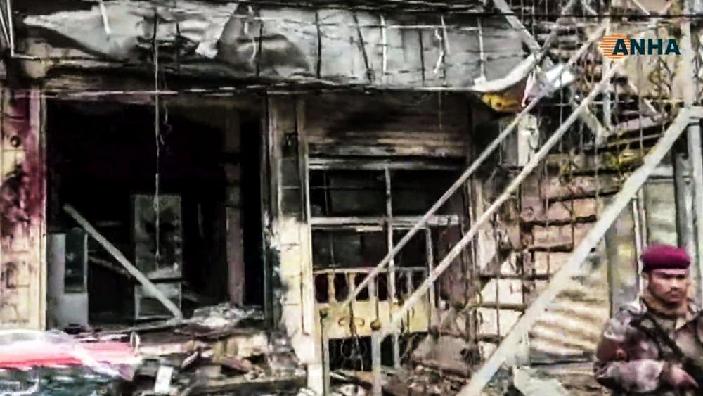 This frame grab from video provided by Hawar News, ANHA, the news agency for the semi-autonomous Kurdish areas in Syria, shows a damaged restaurant where an explosion occurred, in Manbij, Syria, Wednesday, Jan. 16, 2019. Image credit: ANHA via AP.