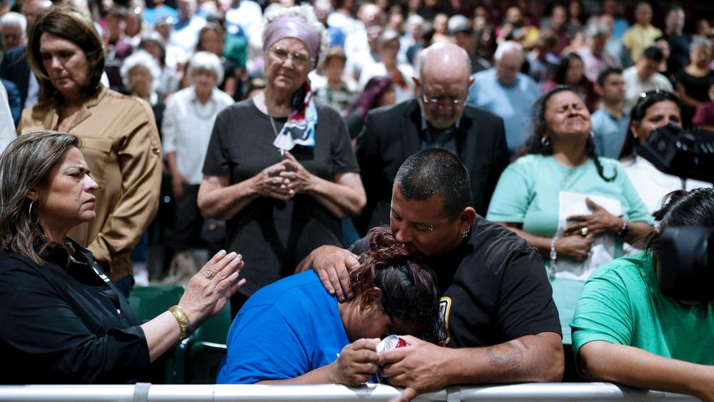 Two family members of one of the victims killed in Tuesday&#039;s shooting at Robb Elementary School comfort each other during a prayer vigil in Uvalde, Texas, Wednesday, May 25, 2022. (AP Photo/Jae C. Hong)