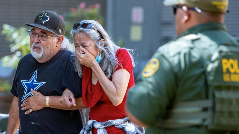 A woman cries as she leaves the Uvalde Civic Center, May 24, 2022, in Uvalde, Texas. An 18-year-old gunman opened fire at a Texas elementary school, killing 19 children and 2 teachers (William Luther/The San Antonio Express-News via AP)