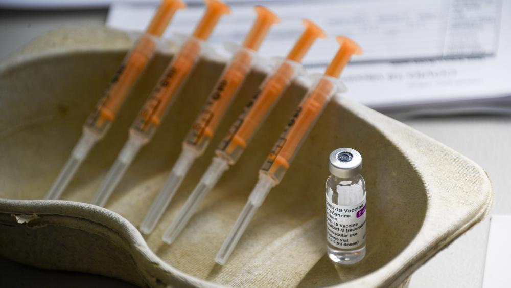 A vial and syringes of the AstraZeneca COVID-19 vaccine, at the Guru Nanak Gurdwara Sikh temple, on the day the first Vaisakhi Vaccine Clinic is launched, in Luton, England, Sunday, March 21, 2021. (AP Photo/Alberto Pezzali)