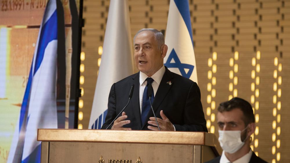 In this Wednesday, April 14, 2021 file photo, Israeli Prime Minister Benjamin Netanyahu speaks at a Memorial Day ceremony at the military cemetery at Mount Herzl, Jerusalem. (AP Photo/Maya Alleruzzo, Pool, File)