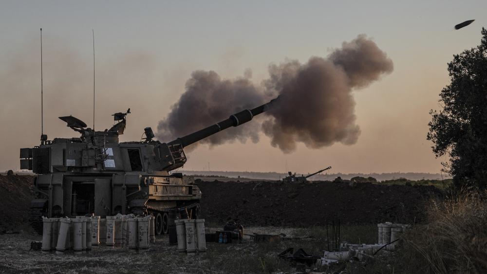 An Israeli artillery unit fires toward targets in Gaza Strip, at the Israeli Gaza border, Tuesday, May 18, 2021. (AP Photo/Tsafrir Abayov)