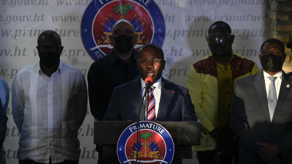 Interim President Claude Joseph speaks during a news conference at his residence in Port-au-Prince, Haiti, Sunday, July 11, 2021, four days after the assassination of Haitian President Jovenel Moise. (AP Photo/Matias Delacroix)