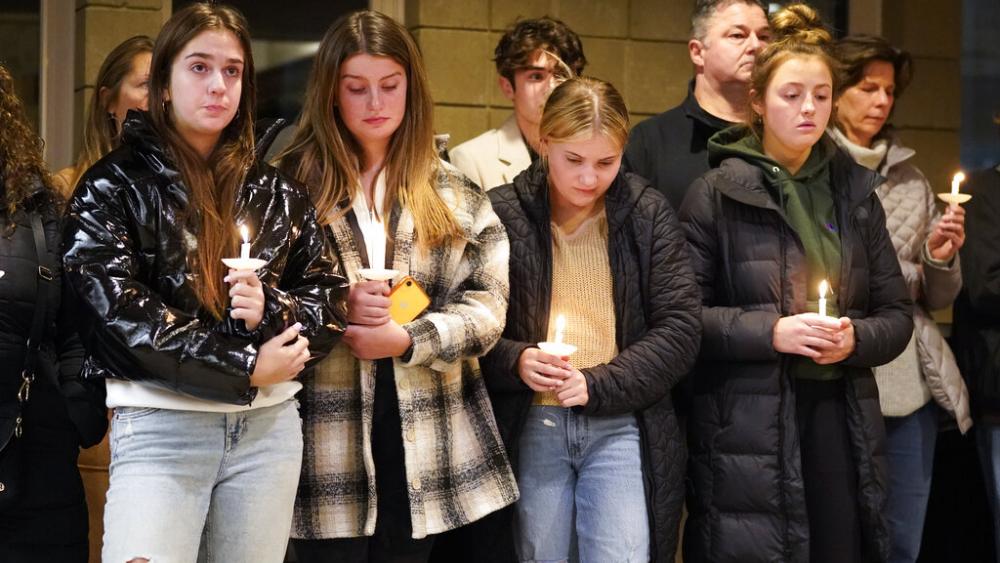 Students attend a vigil at LakePoint Community Church in Oxford, Mich., Tuesday, Nov. 30, 2021. (AP Photo/Paul Sancya)