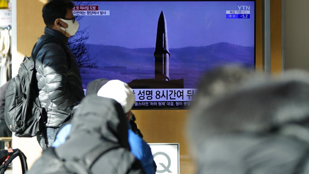 People watch a TV screen showing a news program reporting about North Korea&#039;s missile launch with a file image, at a train station in Seoul, South Korea, Monday, Jan. 17, 2022. (AP Photo/Lee Jin-man)