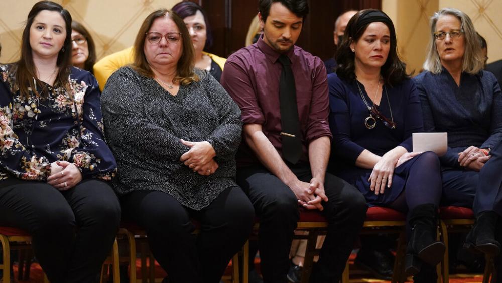 Families of the victims of the Newtown shooting and attorneys listen during a news conference in Trumbull, Conn., Tuesday, Feb. 15, 2022. (AP Photo/Seth Wenig)