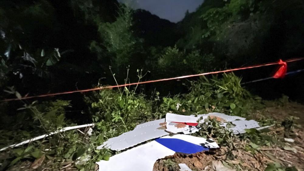 In this photo released by China&#039;s Xinhua News Agency, debris is seen at the site of a plane crash in Tengxian County in southern China&#039;s Guangxi Zhuang Autonomous Region, Tuesday, March 22, 2022.  (Zhou Hua/Xinhua via AP)