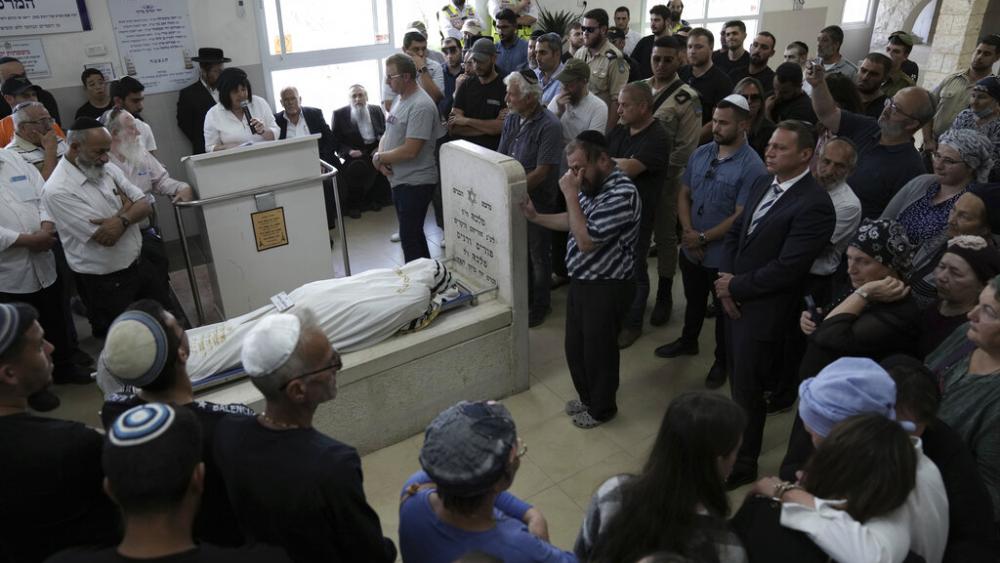 Zeev Golev, center, weeps at the funeral for his son, Daniel Vyacheslav Golev in Beit Shemesh, Israel, Sunday, May 1, 2022. (AP Photo)