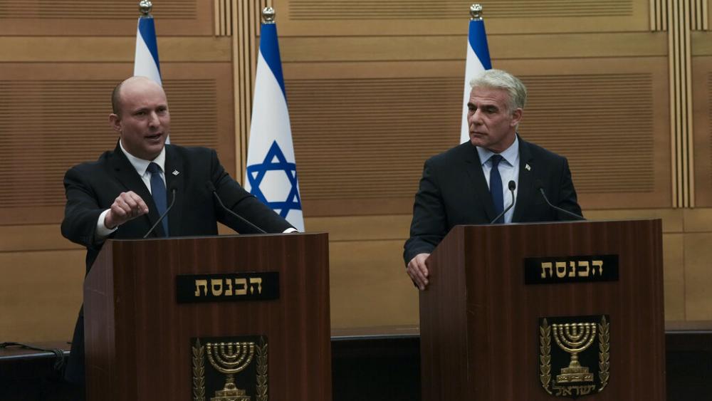 Israeli Prime Minister Naftali Bennett, left, speaks during a joint statement with Foreign Minister Yair Lapid, at the Knesset, Israel's parliament, in Jerusalem, Monday, June 20, 2022. (AP Photo)