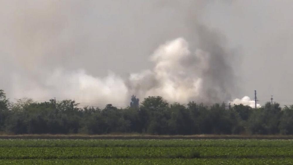 In this image taken from video provided by the RU-RTR Russian television on Tuesday, Aug. 16, 2022, smoke rises over the site of explosion at an ammunition storage of Russian army. (RU-RTR Russian Television via AP)
