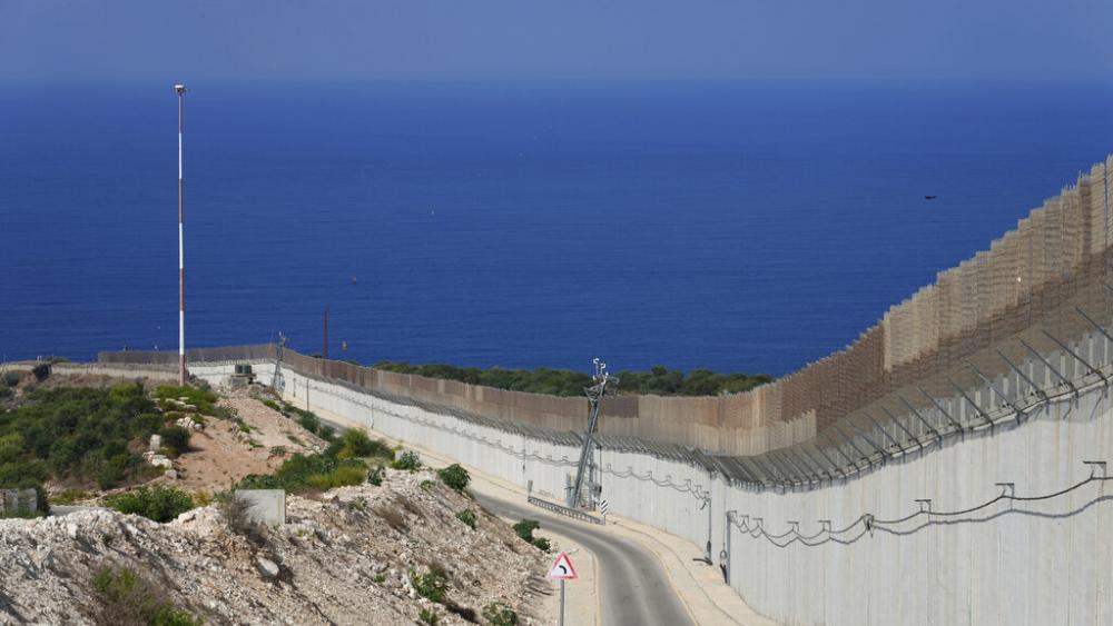 The wall on the Israeli border with Lebanon, seen at right, with the Mediterranean Sea in the distance, in Ras Hanikra, Israel, Friday, Oct. 14, 2022. (AP Photo)
