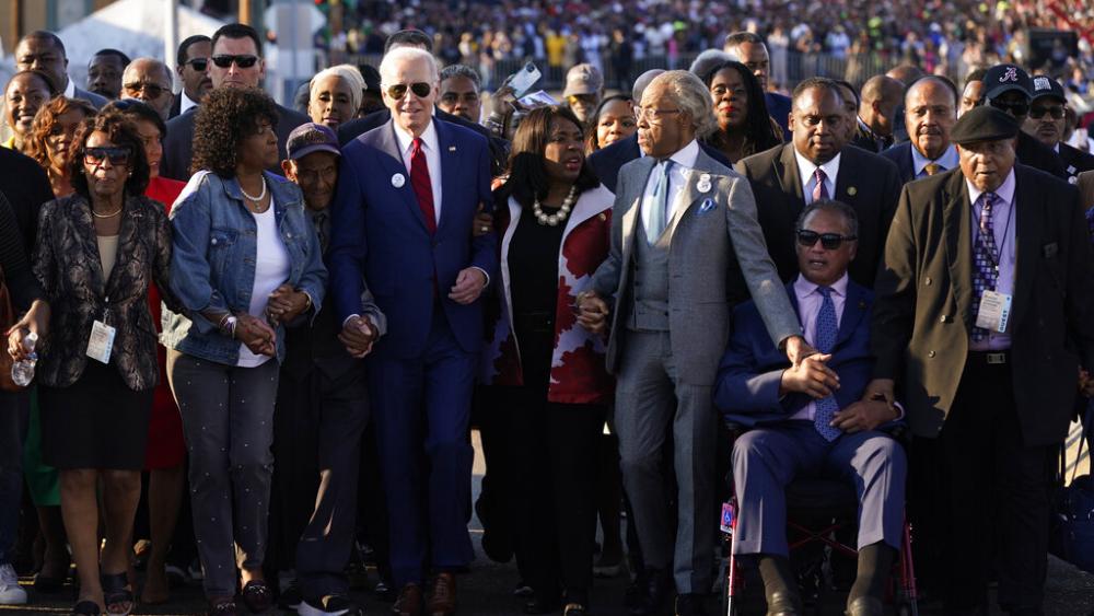 President Joe Biden prepares to walk across the Edmund Pettus Bridge in Selma, Ala., Sunday, March 5, 2023, to commemorate the 58th anniversary of &quot;Bloody Sunday,&quot; a landmark event of the civil rights movement. (AP Photo/Patrick Semansky)