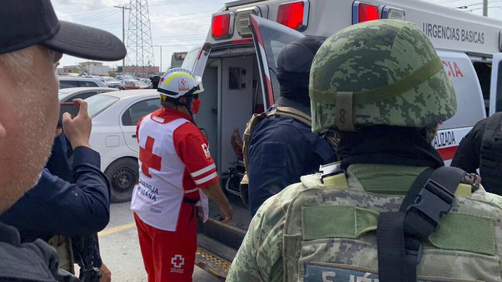 A Red Cross worker closes the door of an ambulance carrying two Americans found alive after their abduction in Mexico last week, in Matamoros, March 7, 2023 (AP Photo)