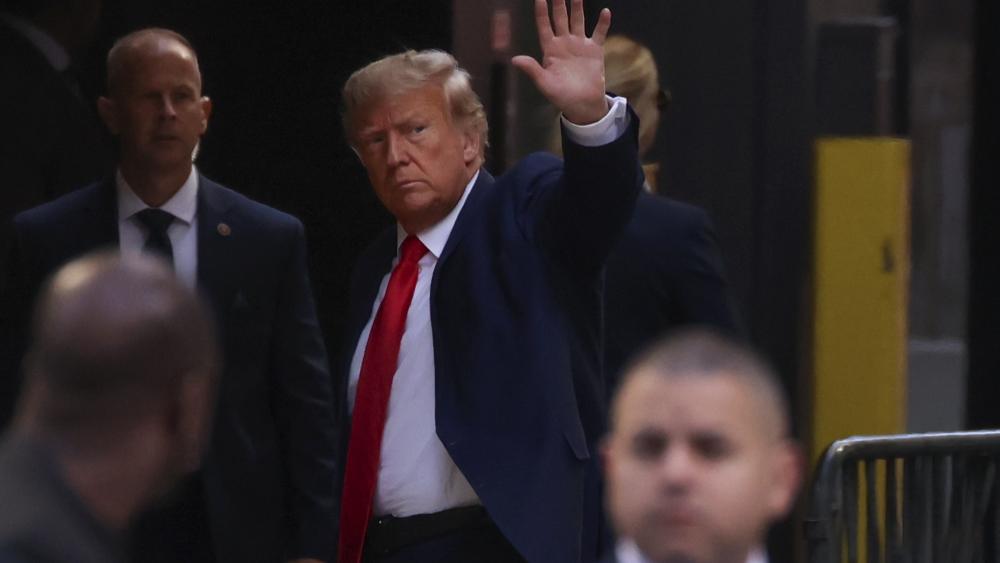 Former President Donald Trump arrives at Trump Tower, Monday, April 3, 2023, in New York before for his expected booking and arraignment on Tuesday. (AP Photo/Yuki Iwamura)