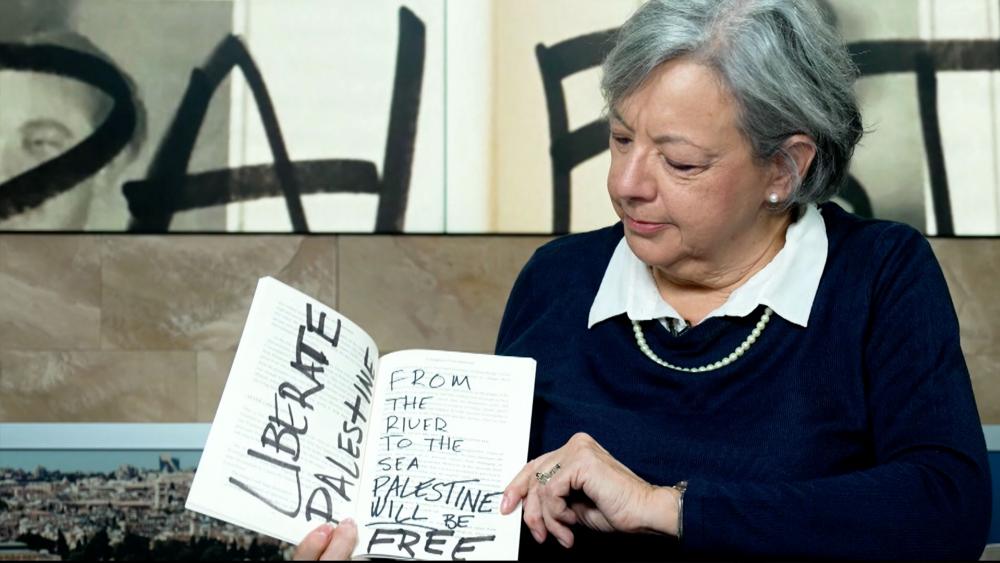 Melanie Sol reveals the antisemitic defacement of her book, &quot;Daughter of the Holocaust.&quot; Photo Credit: CBN News.