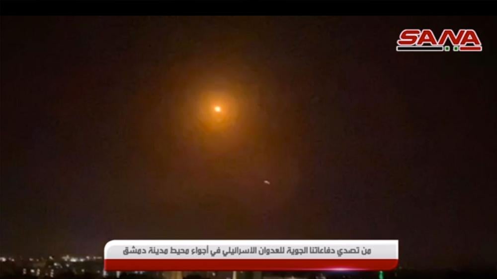 Trace of light for purported missile near Damascus. 15 Feb 2021. Screenshot of SANA video via AP