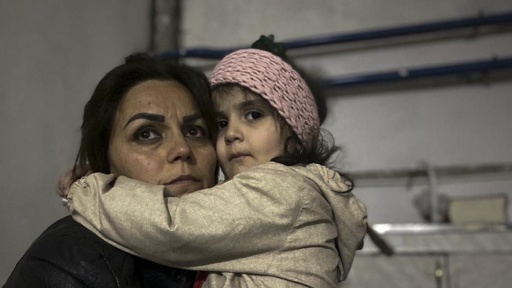 A girl embraces her relative sitting in a shelter during shelling in Stepanakert, Nagorno-Karabakh. (AP Photo/Siranush Sargsyan)