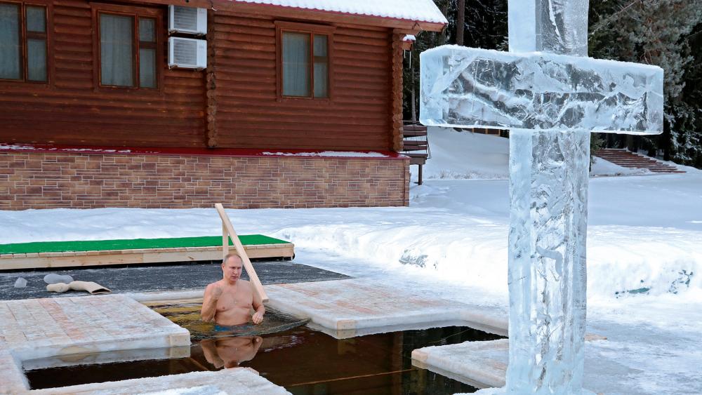 Russian President Vladimir Putin bathes in icy water during an Epiphany celebration outside Moscow, Jan. 19, 2021. (Mikhail Klimentyev, Sputnik, Kremlin Pool Photo via AP)