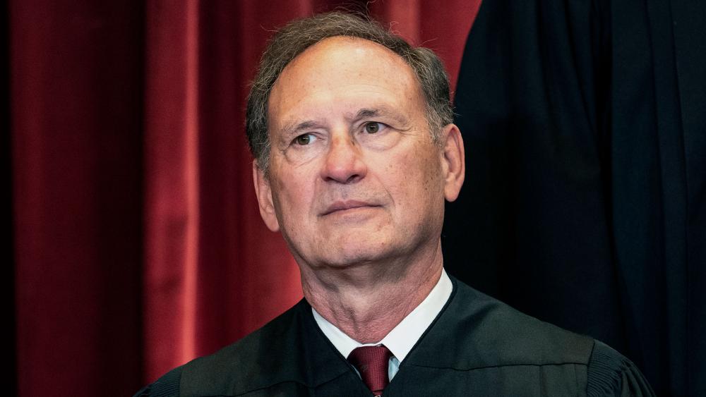 Associate Justice Samuel Alito sits during a group photo at the Supreme Court in Washington, Friday, April 23, 2021. (Erin Schaff/The New York Times via AP, Pool)