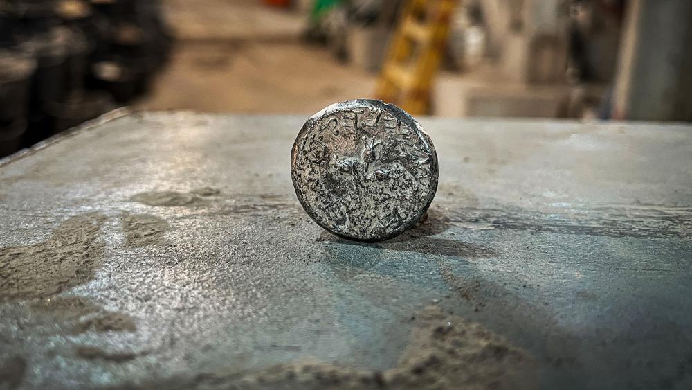 Ancient coin discovered in dirt from archeological excavations conducted by the Israel Antiquities Authority on the &quot;Pilgrimage Road,&quot; in the City of David National Park. Photo Credit: CBN News