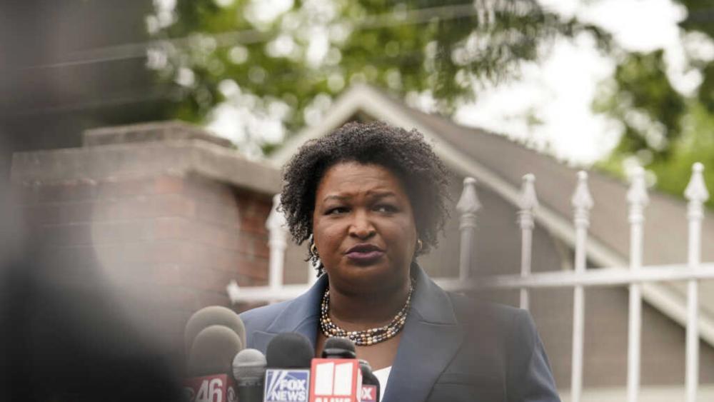 Georgia Democratic gubernatorial candidate Stacey Abrams talks to the media during the Georgia&#039;s Primary election on Tuesday, May 24, 2022, in Atlanta. (AP Photo/Brynn Anderson)